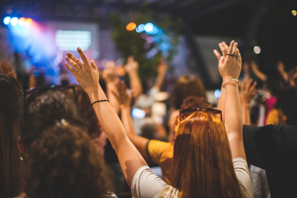 a-church-congregation-raising-their-hands-in-worship-together