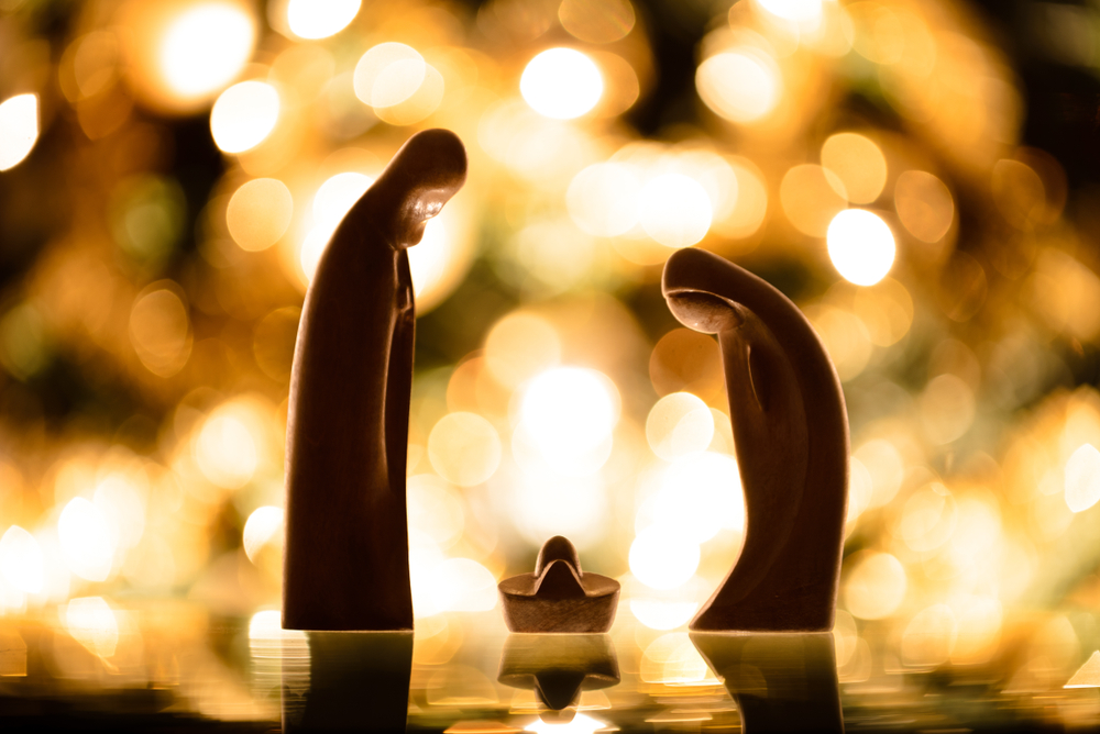 wooden-Nativity-with-bright-lights-in-the-background